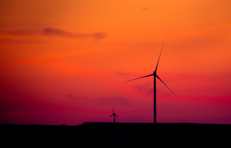 silhouette of  wind turbines at sunset, power and energy conceptの写真素材