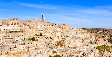 panoramic view of typical stones (Sassi di Matera) and church of Matera under blue sky. Basilicata, Italyの写真素材