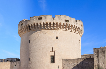 ruins of medieval old tower of castle under blue sky in Matera Italyの写真素材
