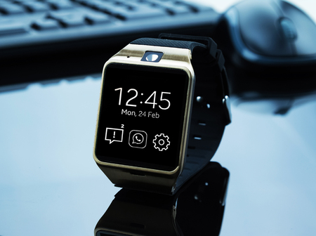 smartwatch near computer pc keyboard and mouse , new technology conceptの写真素材