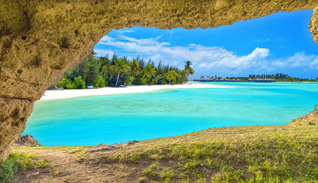Panoramic view through cave of natural sea beach under summer blue sky, travel holiday conceptの写真素材