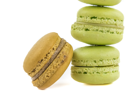 stacked green and brown cake macaron isolated on white background, maccarone sweet and colorful dessertの写真素材