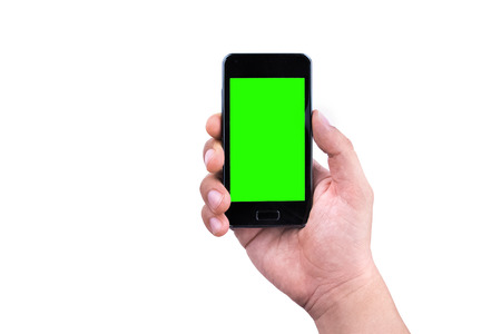 hand of man holding mobile smart phone with chroma key green screen on white background, new technology conceptの写真素材