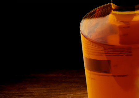 whiskey bottle on dark wood table background, whisky relax time  conceptの写真素材