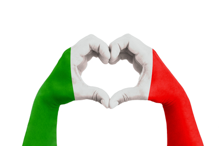 pray for italy, man hands in the form of heart with the flag of italy on the white background, concept for hope and helpful support for the Italy earthquake victimsの写真素材