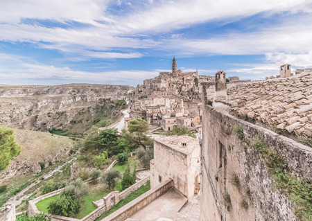 panoramic view of typical stones (Sassi di Matera) and church of Matera under blue sky, artistic style. Matera in Italy UNESCO European Capital of Culture 2019の写真素材