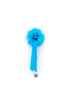 male newborn blue ribbon hanging on the house white door with spyhole backgroundの写真素材