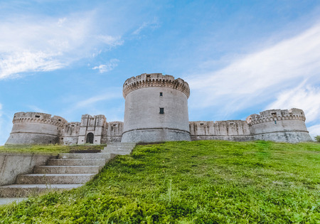 ruins of medieval old tower of castle with stairs under blue sky in Matera Italy, fortress in Materaのeditorial素材