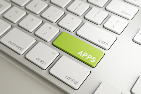 apps word symbol on green button key of white keyboard, software program application for smartphone...