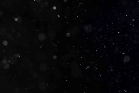 abstract dust fog particles movement on black dark background loop seamless overlay readyの写真素材