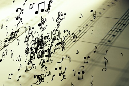 a lot of musical notes flying on vintage old the stave pentagram backgroundの写真素材