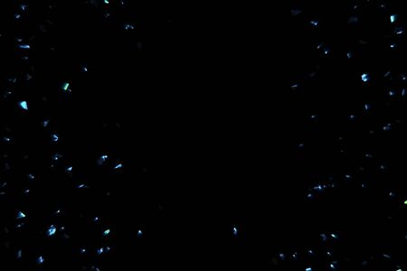 electric blue sparkle background with particles flowing on black, holiday festive conceptの写真素材