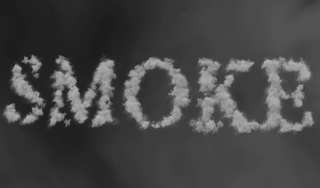 smoke word made by floating smoke steam through space on grey blur background, danger health conceptの写真素材