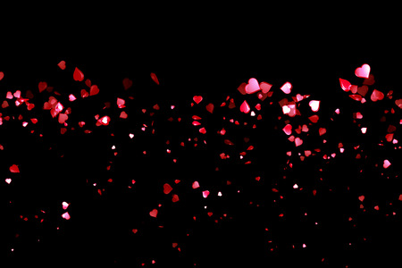 valentine day, waterfall of red hearts shape on black background, holiday festive valentine day love conceptの写真素材