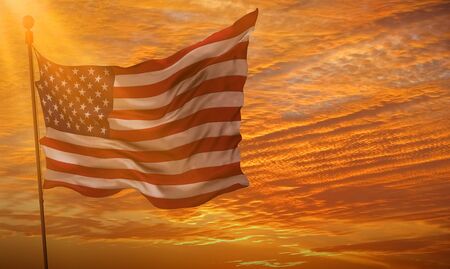 closeup of american USA flag, stars and stripes, united states of america, at sunset, with sun rays...