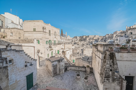 panoramic view of typical stones (Sassi di Matera) near gravina of Matera UNESCO European Capital of Culture 2019 on blue sky. Basilicata, Italyのeditorial素材