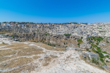 panoramic view of typical stones house (Sassi di Matera) of Matera UNESCO European Capital of Culture 2019 under blue sky. Basilicata, Italyの写真素材