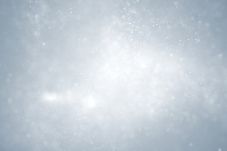 christmas silver background with glitter bokeh flowing, festive holiday happy new year conceptの写真素材