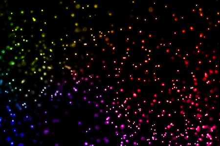 christmas multicolor sparkle glitter explosion dust particles background with bokeh, color holiday happy new year and valentine day love, relationship conceptの写真素材