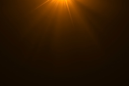 gold warm color bright lens flare rays light flashes leak movement for transitions on black background,movie titles and overlayingの写真素材