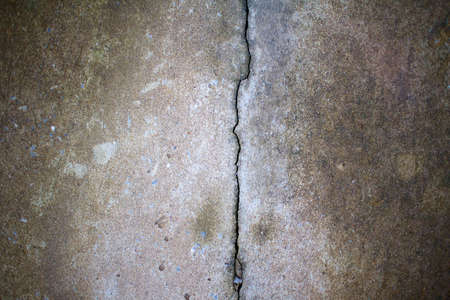 Fractured concrete surface closeup background.の写真素材
