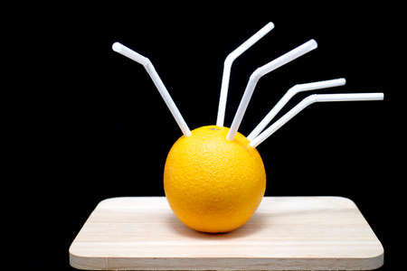 oranges with tube isolated on white background