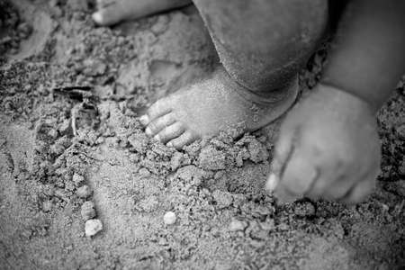 Baby foot sand.black and white.の写真素材