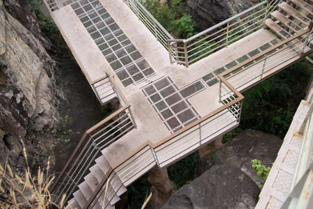 Wooden bridge, steel walkway floor has several intersections.