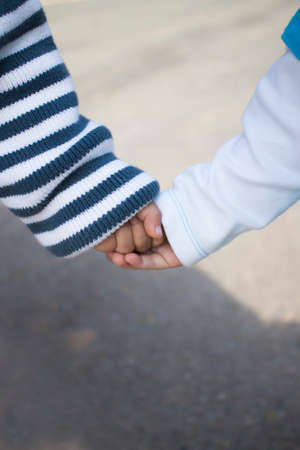 Children holding hands walking
