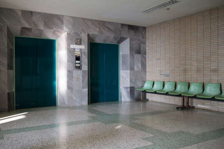 The elevator doors and waiting.