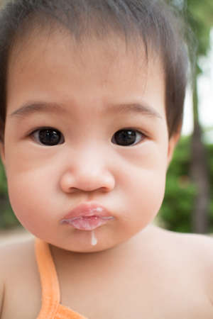 Asian children eating ice creamの写真素材