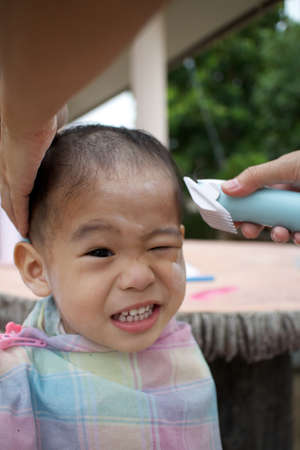 Boy haircut, Asia, Thailand.の写真素材