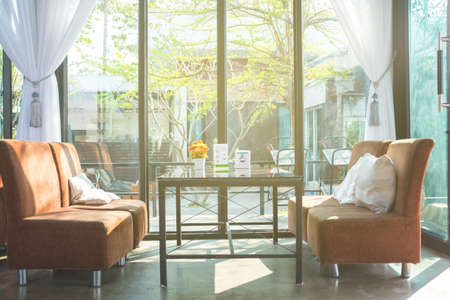 Sofa by the windowの写真素材