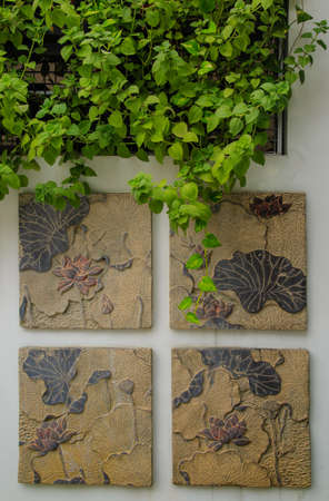 ancient stone relief of lotusの写真素材