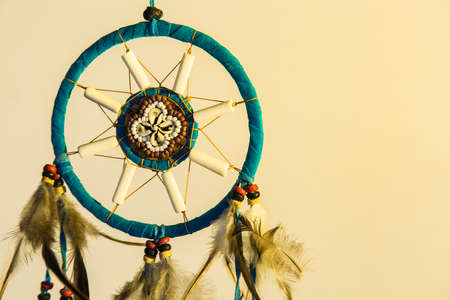 dream catcher hanging on white backgroundの写真素材