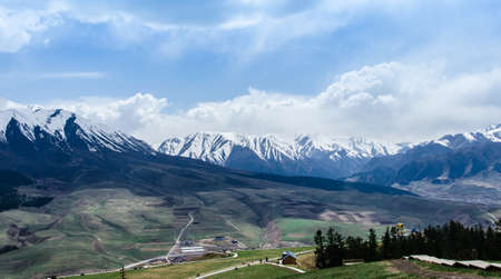 snow mountain and small villageの写真素材