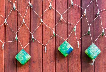 KETUPAT Net Light Led display on wood board backgroundの写真素材