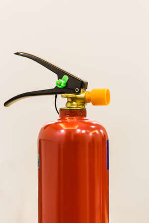 Fire extinguisher isolated closeup on white backgroundの写真素材