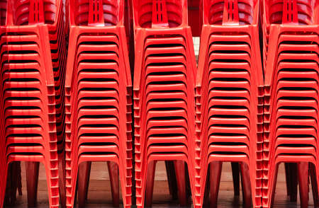 Render Of Stacked Red color Chairs backgroundの写真素材