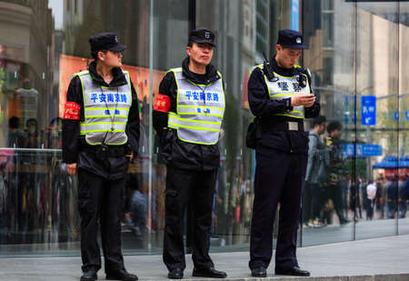 China,Shanghai-19 APR 2019:security police standing on the nanjing road in shanghai