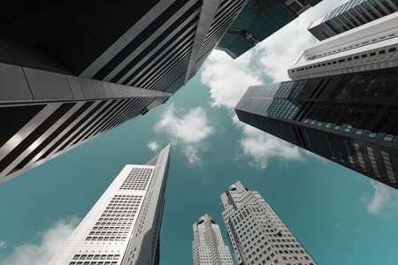 SINGAPORE - 16 FEB 2018: Business buildings skyline looking up with blue sky background.