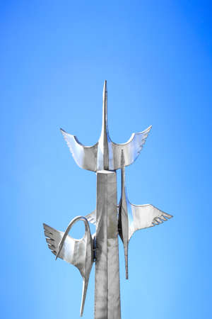 Hegang, China - 04 OCT 2018: Flying cranes sculpture in the blue skyのeditorial素材