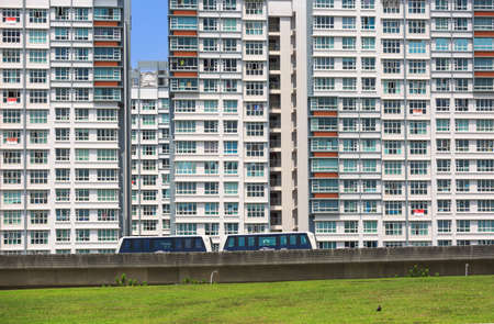 Singapore-27 JUL 2019: Singapore Punggol area residentail building and lrt train