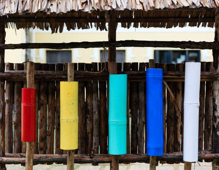 colorful bamboo container display on a wood wall