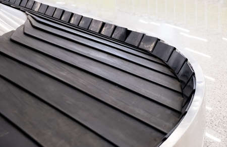 conveyor belt in arrivals lounge of airport terminal for traveler , passenger or business man 's...