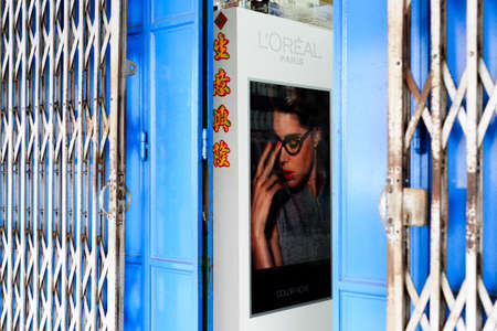 Singapore-14 JUL 2018: vintage style shop open gate with retro posterのeditorial素材