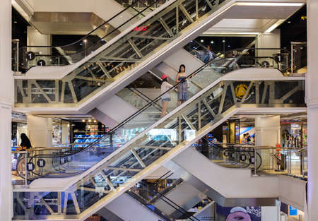 Bangkok,Thailand-02 APR 2018: People in motion in escalators at the modern shopping mallの写真素材