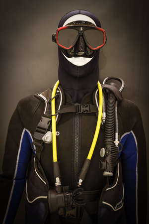 Singapore-08 JUL 2018: models with Diving equipment. Isolated on black background