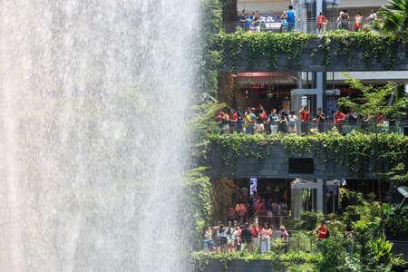 SINGAPORE-12 OCT 2019: The Rain Vortex, a 40m-tall indoor waterfall located inside the Jewal Changi Airport in Singaporeの写真素材