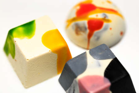 beautiful chocolate cubes placed on white backgroundの写真素材